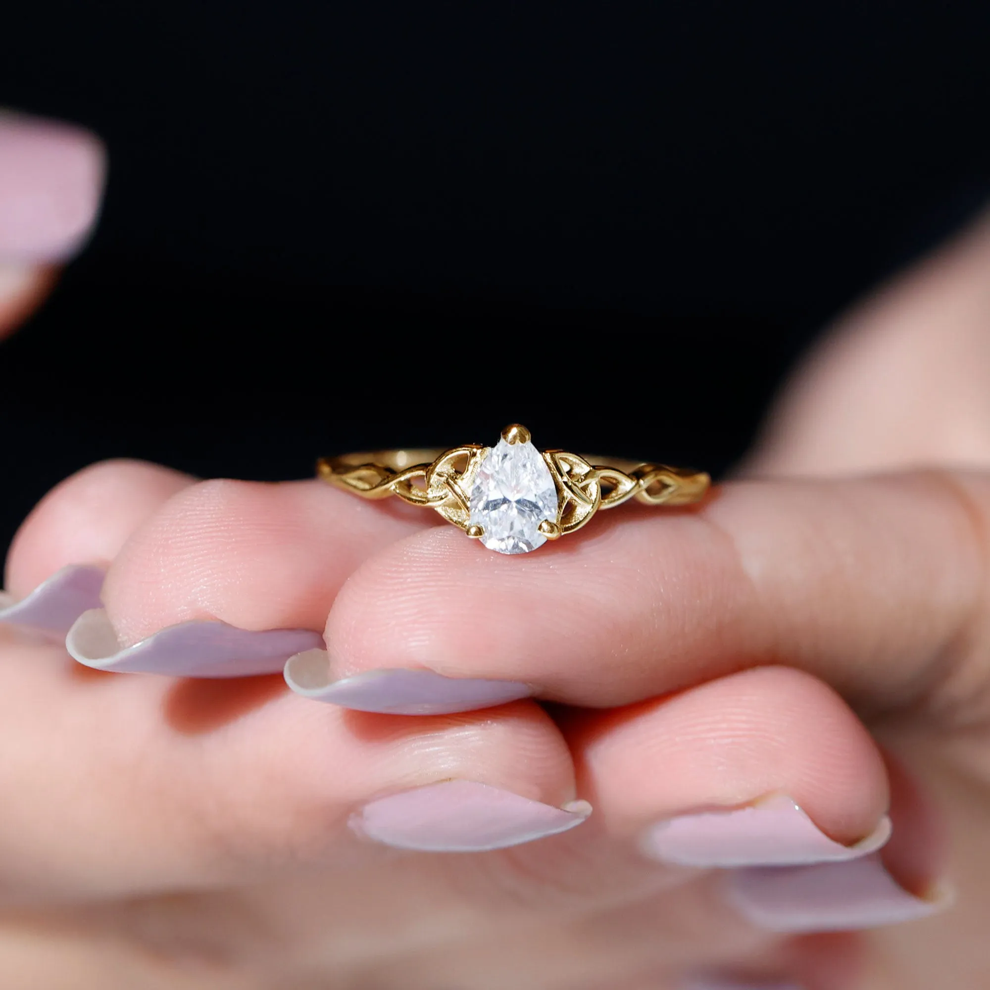 5X7 MM Pear Cut Moissanite Solitaire Ring with Celtic Detailing