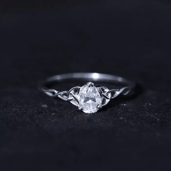 5X7 MM Pear Cut Moissanite Solitaire Ring with Celtic Detailing