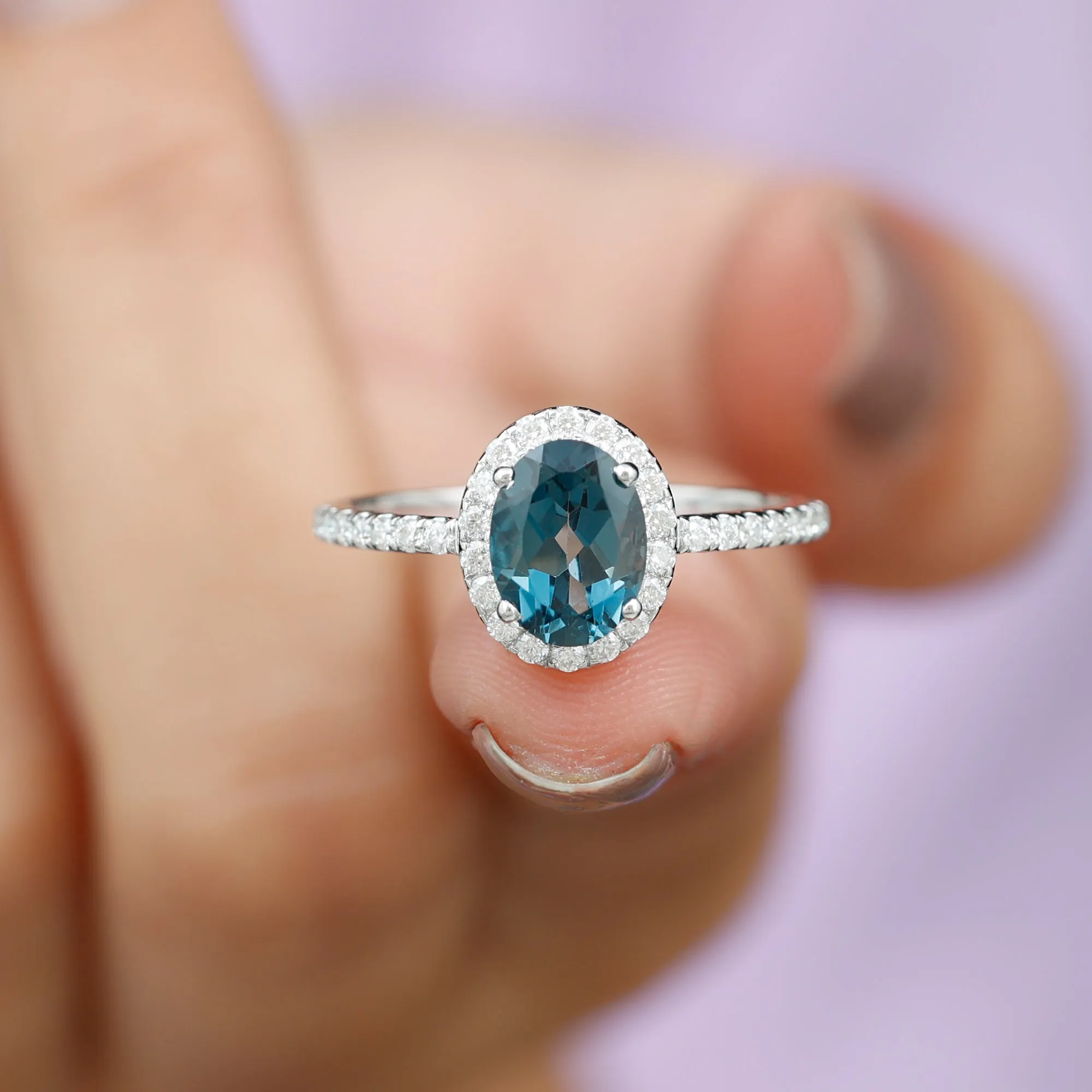 8X6 MM Oval Cut London Blue Topaz Solitaire with Diamond Side Stone Ring