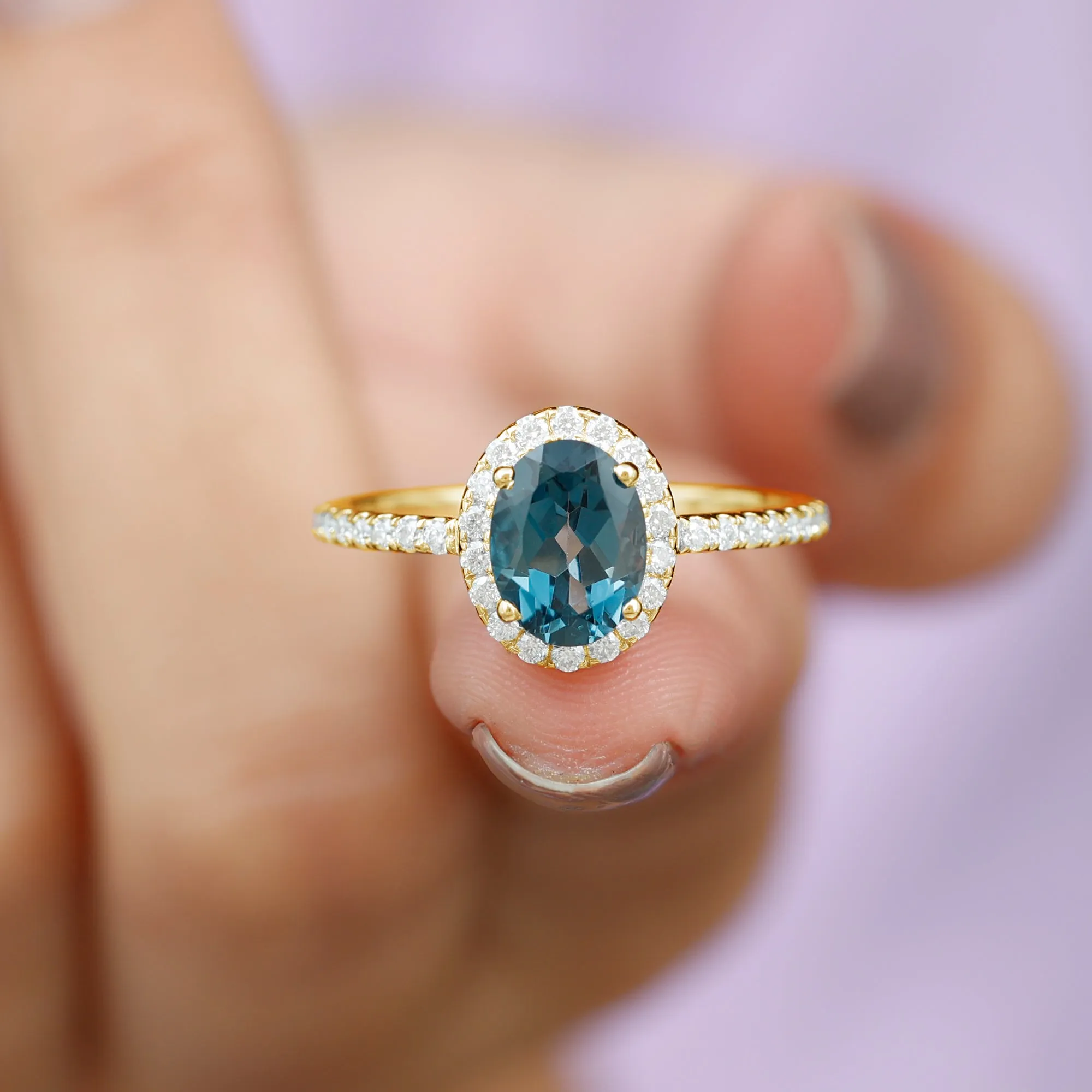 8X6 MM Oval Cut London Blue Topaz Solitaire with Diamond Side Stone Ring
