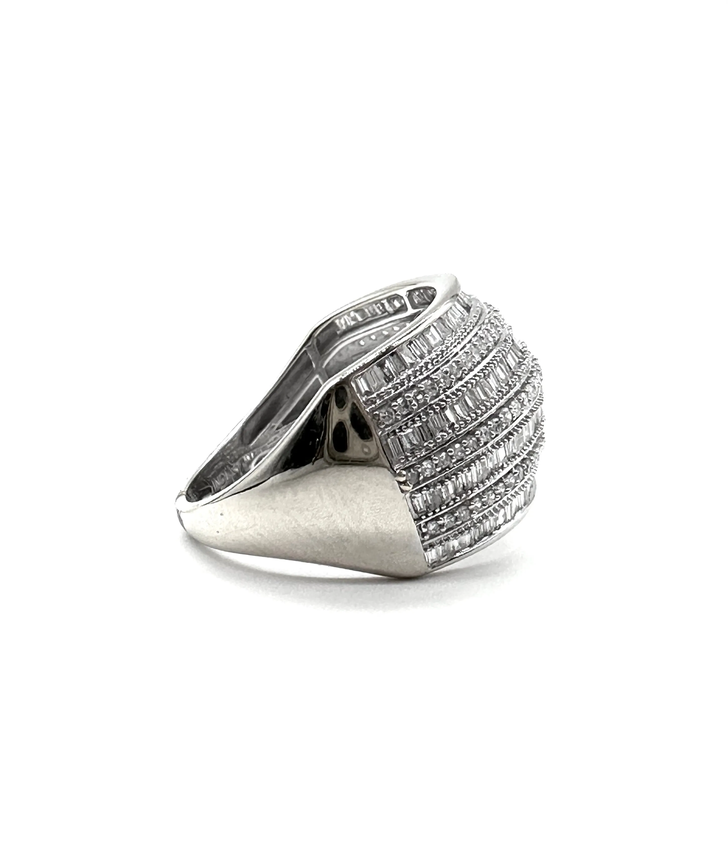 Alternating diamond baguette and round stone dome ring