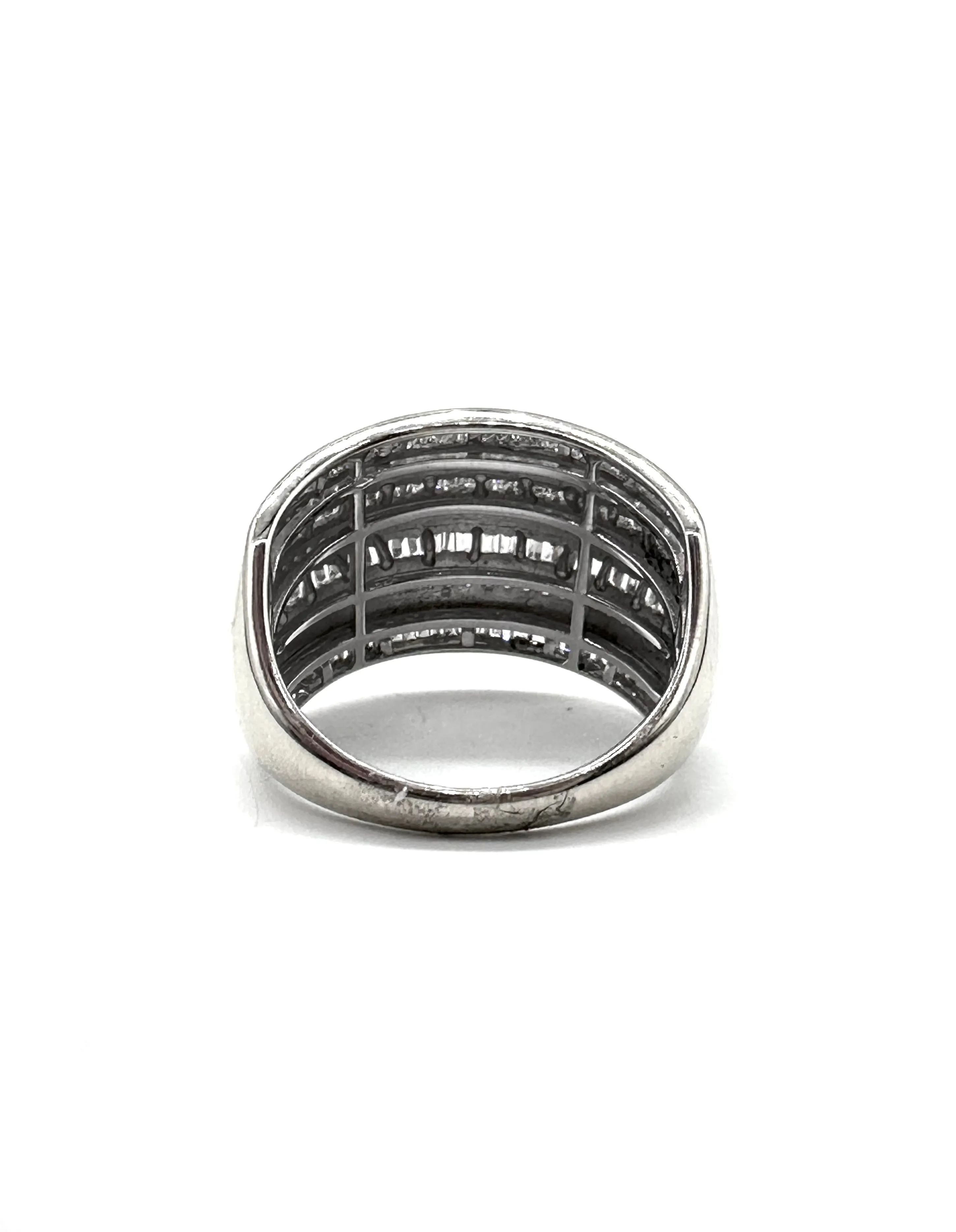 Alternating diamond baguette and round stone dome ring
