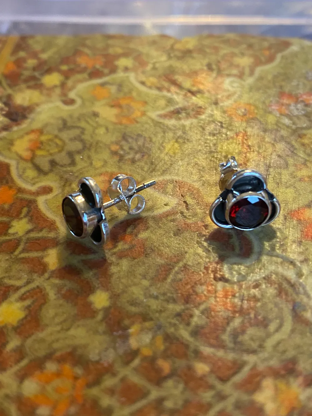 Solid Silver Garnet Stud Earrings with Triple Curve Frame
