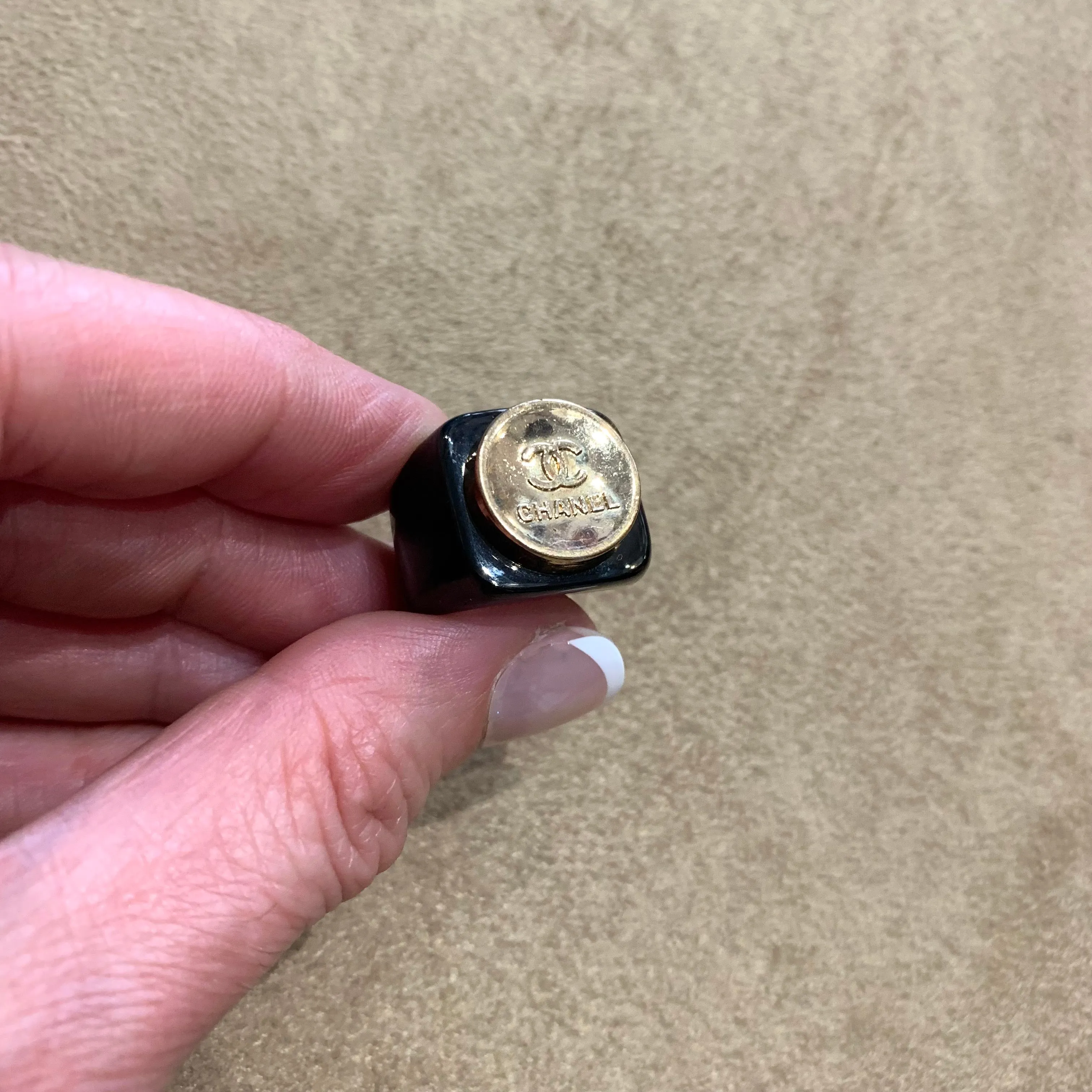 Vintage Chanel gold button ring in black setting