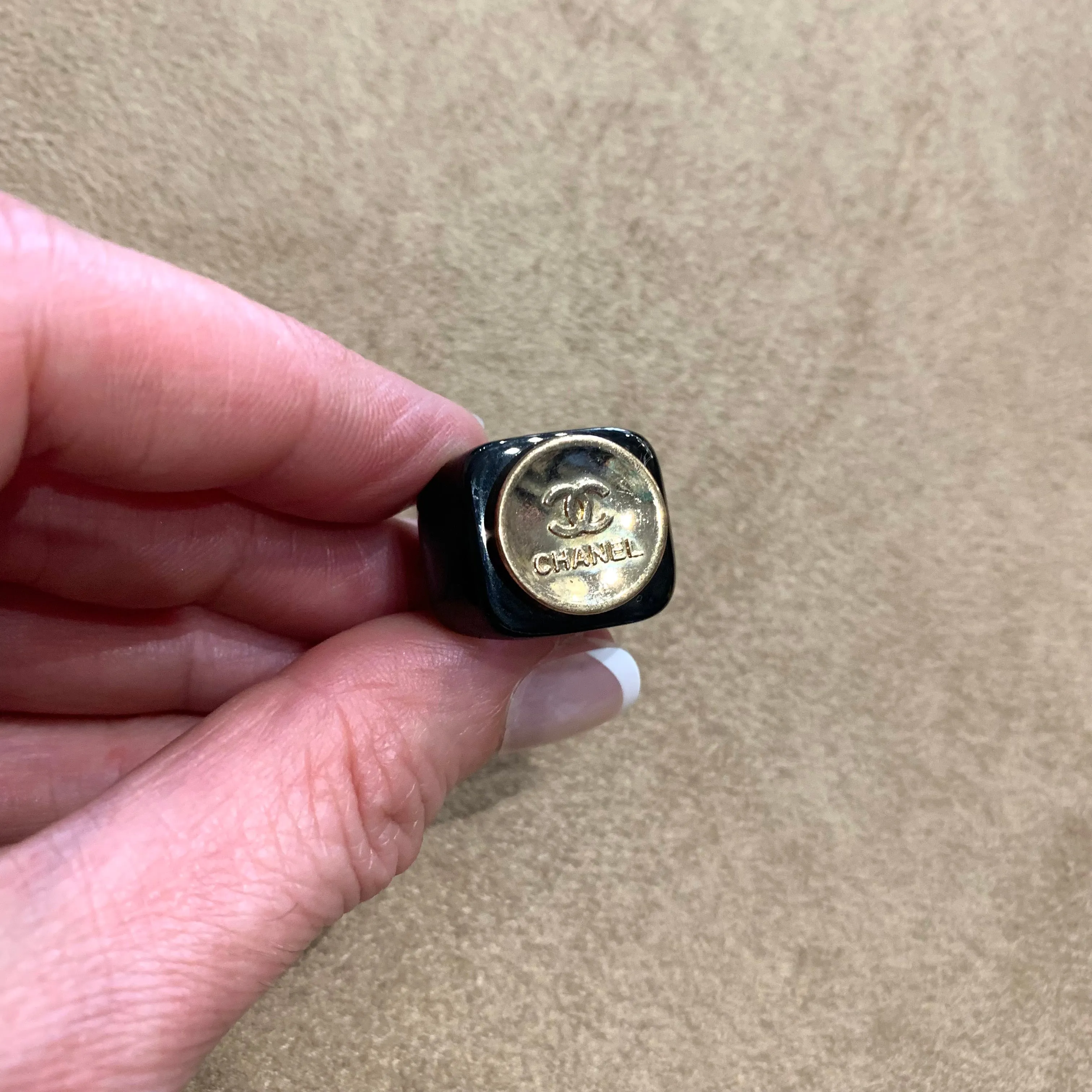 Vintage Chanel gold button ring in black setting