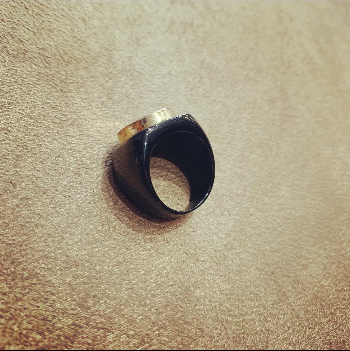 Vintage Chanel gold button ring in black setting